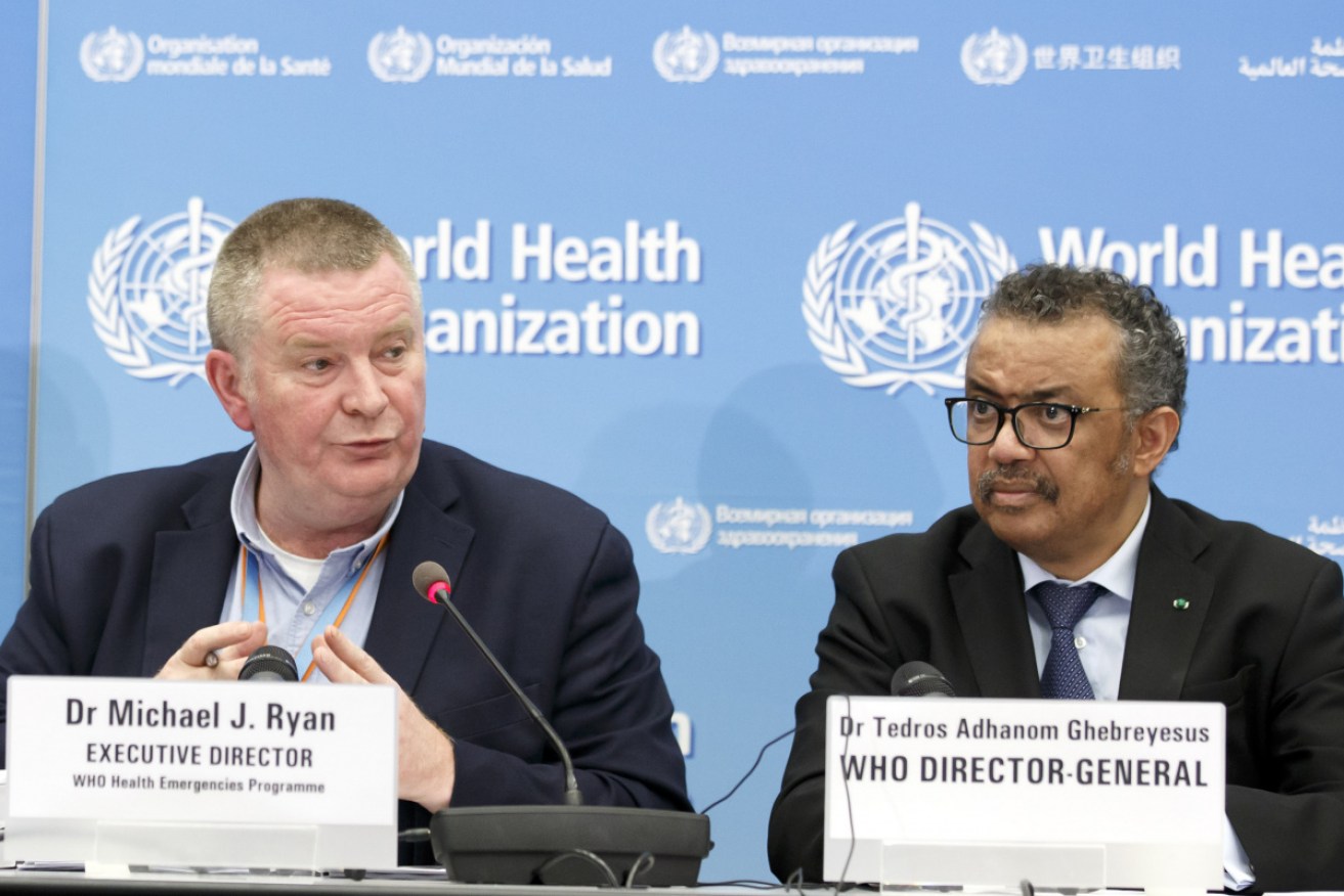 Dr Michael Ryan, with WHO chief Dr Tedros in February 2020, says the pandemic will not end in 2021.