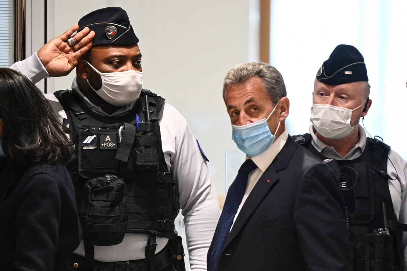 Nicolas Sarkozy arrives at court to hear his sentence on a bribery charge.