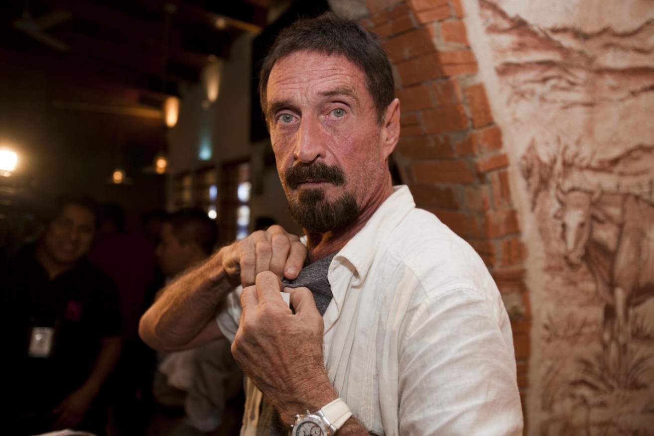 Software company founder John McAfee, pictured here during a media interview in 2017, has been charged with fraud.