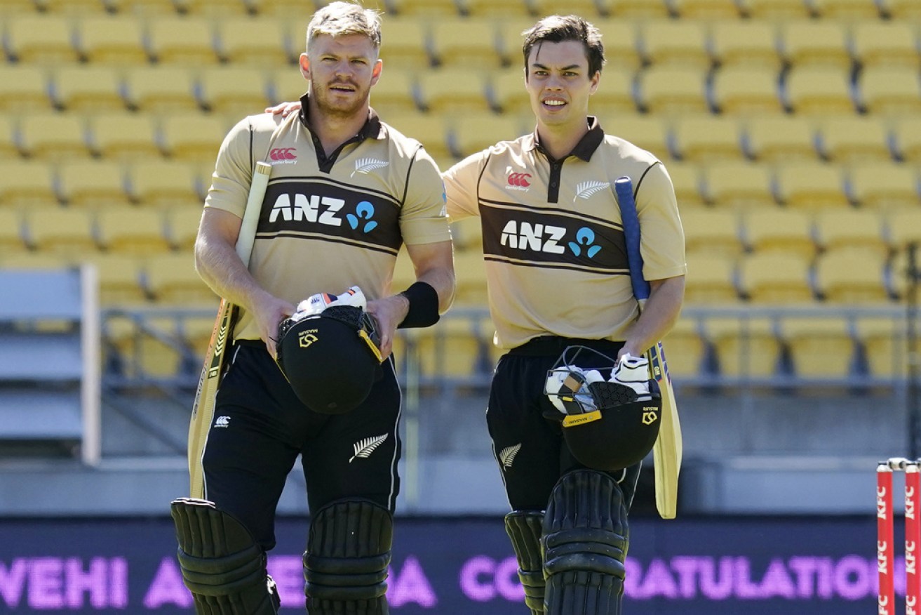 Glenn Phillips and Mark Chapman walk off after beating Australia to claim the T20 series at Wellington on Sunday.