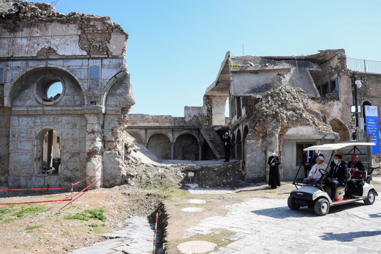 Pope Francis is shown the devastated Syrian Catholic Cathedral after a prayer for the victims of the war in Mosul.