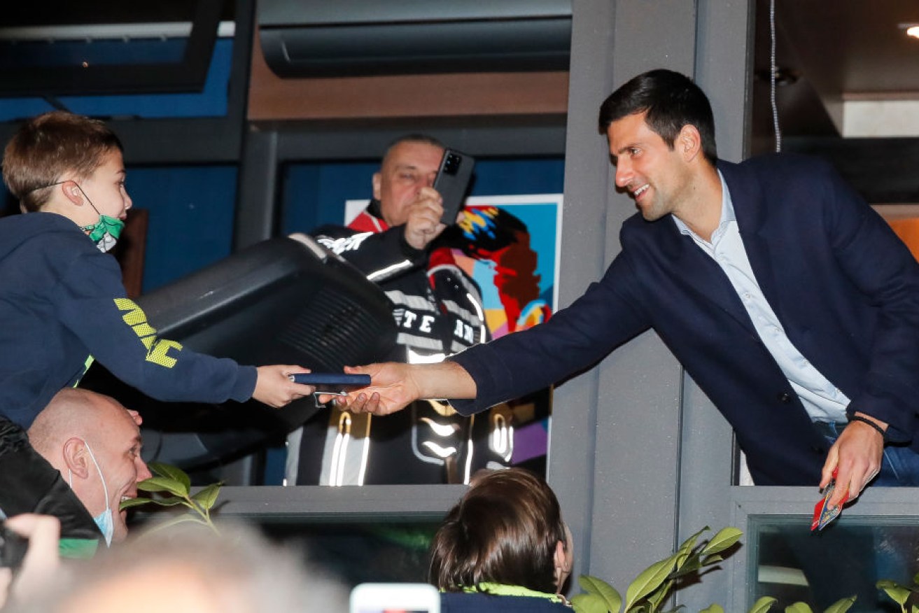 Novak Djokovic celebrates with fans in Belgrade.