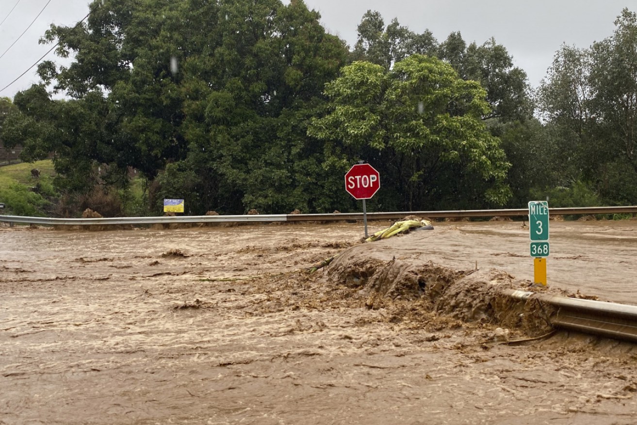 Flood waters sweep over the Hana Highway in Haiku, Maui, Hawaii, on Monday, US time. 