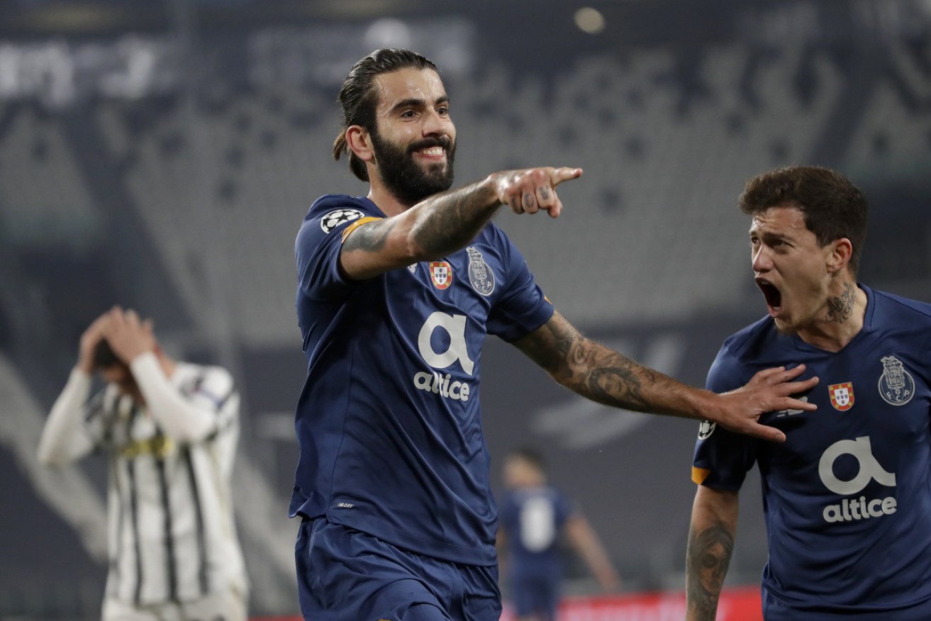 Porto's Sergio Oliveira celebrates after scoring the opening goal.