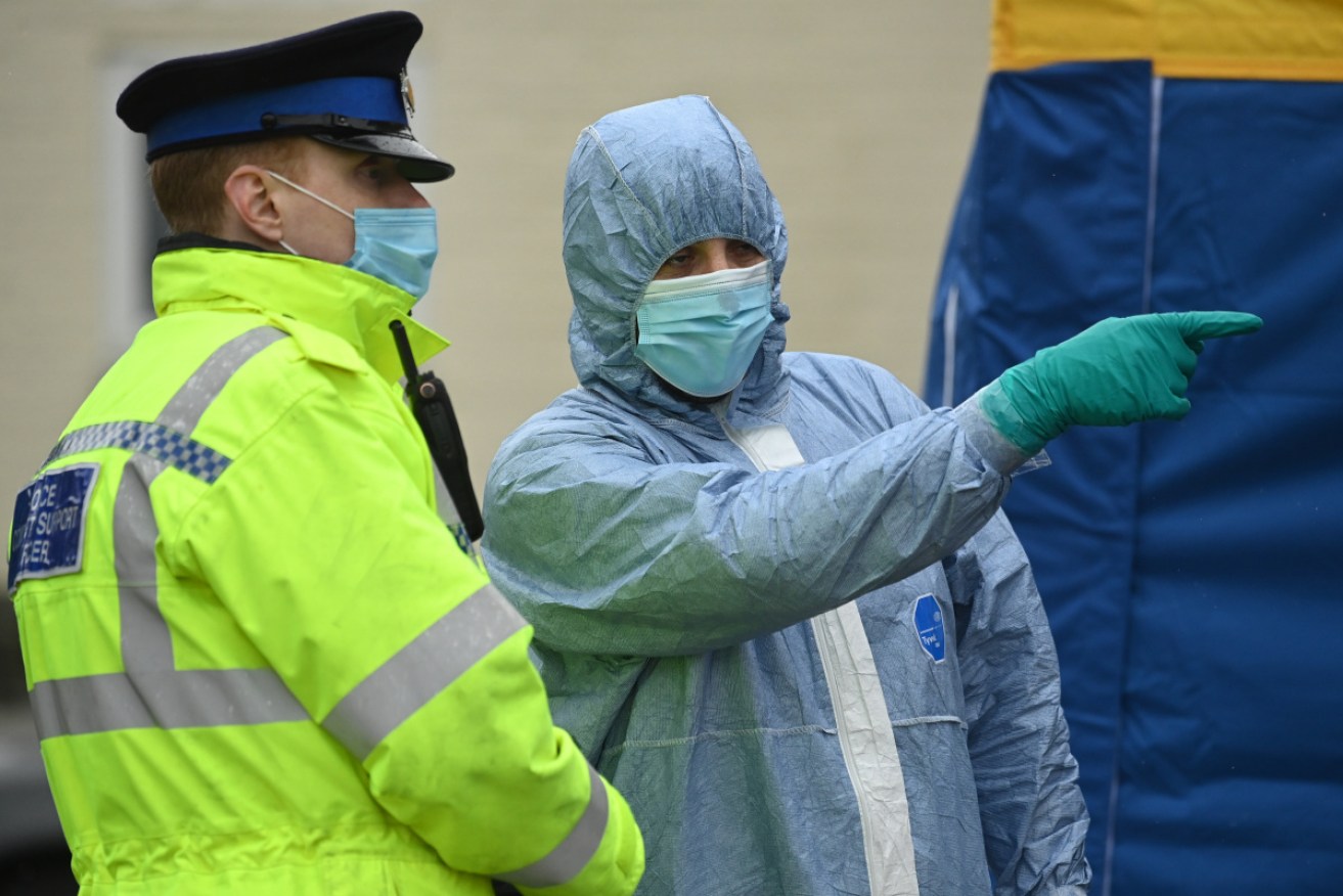 Police search a south London house during their investigation into the disappearance Sarah Everard.