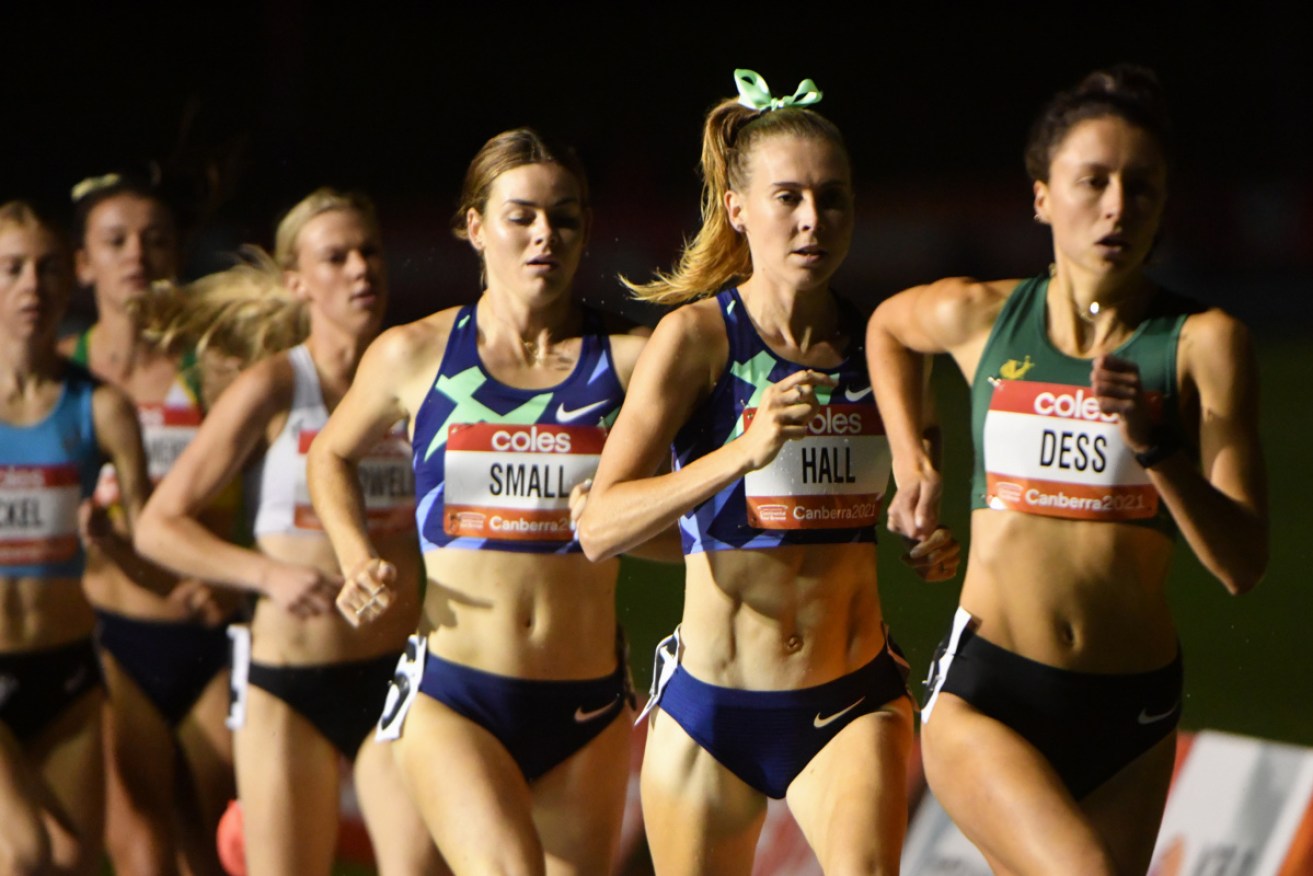 Linden Hall, second from right, jockeys for position in the women’s 1500m at the Canberra Track Classic on Thursday night.
