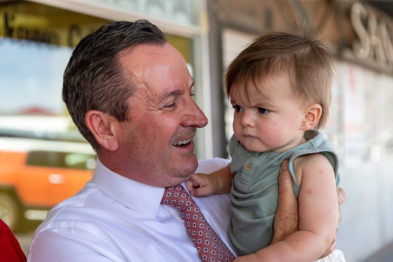 Politicians and babies: WA Premier Mark McGowan meets a somewhat bemused Kalgoorlie local on the campaign trail.