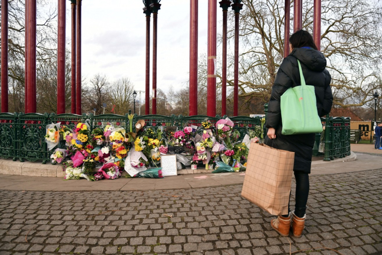 Flowers are left at Clapham Common, after Sarah Everard's body was found hidden in woodland.