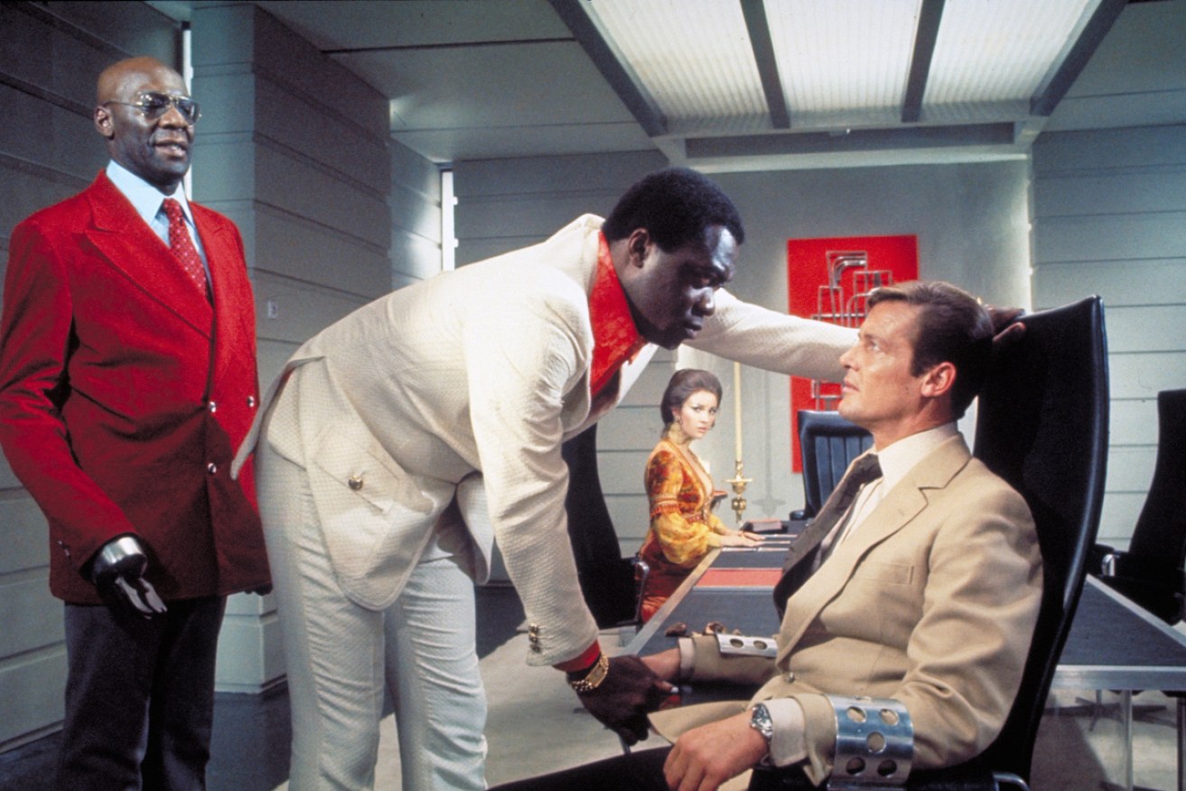 Yaphet Kotto grills Roger Moore in <i>Live And Let Die</i>.