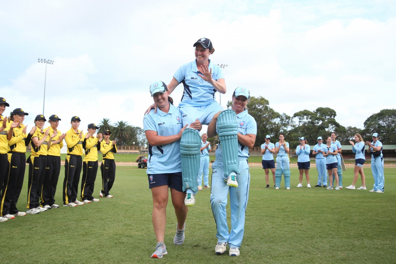Rene Farrell is carried from the field by her NSW Breakers teammates after the WNCL final at North Sydney Oval in February 2020.