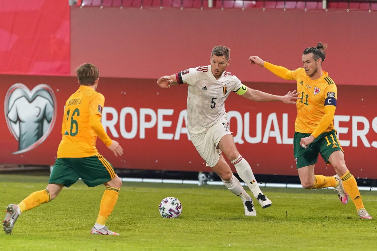 Jan Vertonghen of Belgium competes for the ball with Wales' Gareth Bale.