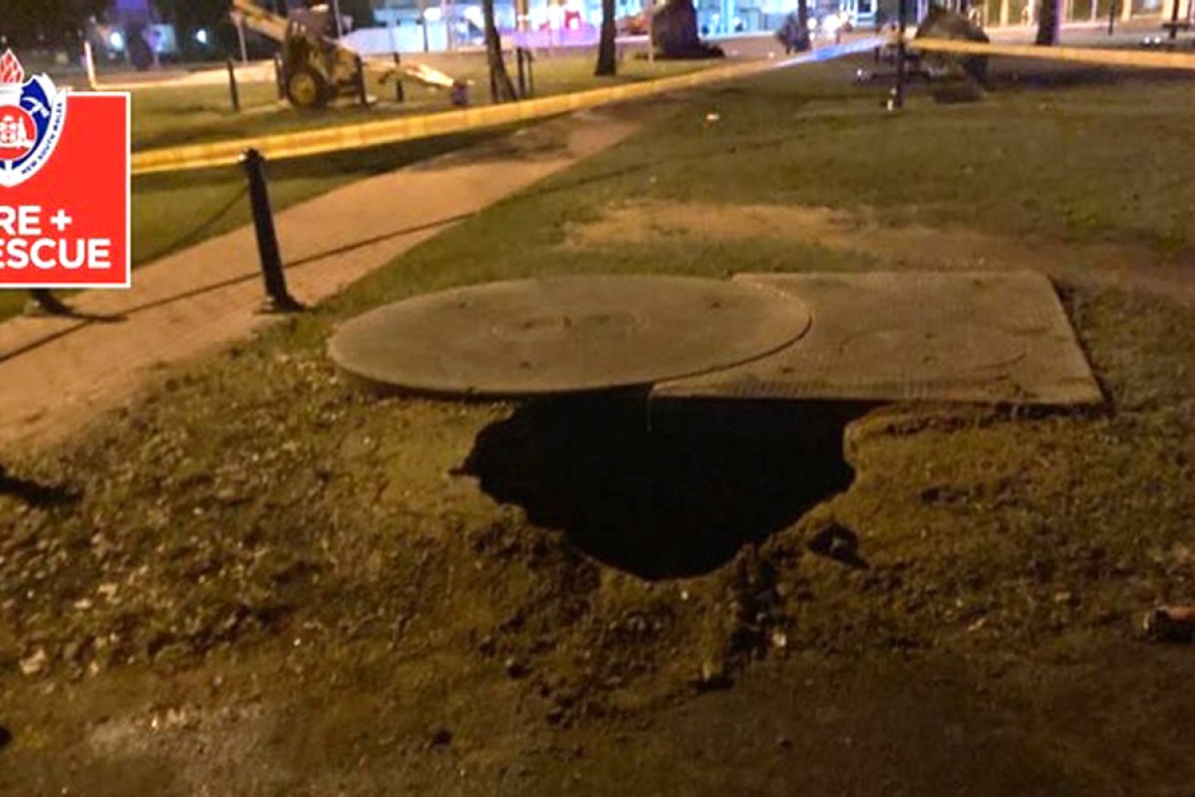 Three people were trapped in this sinkhole when riverbanks in Moree collapsed late on Wednesday.