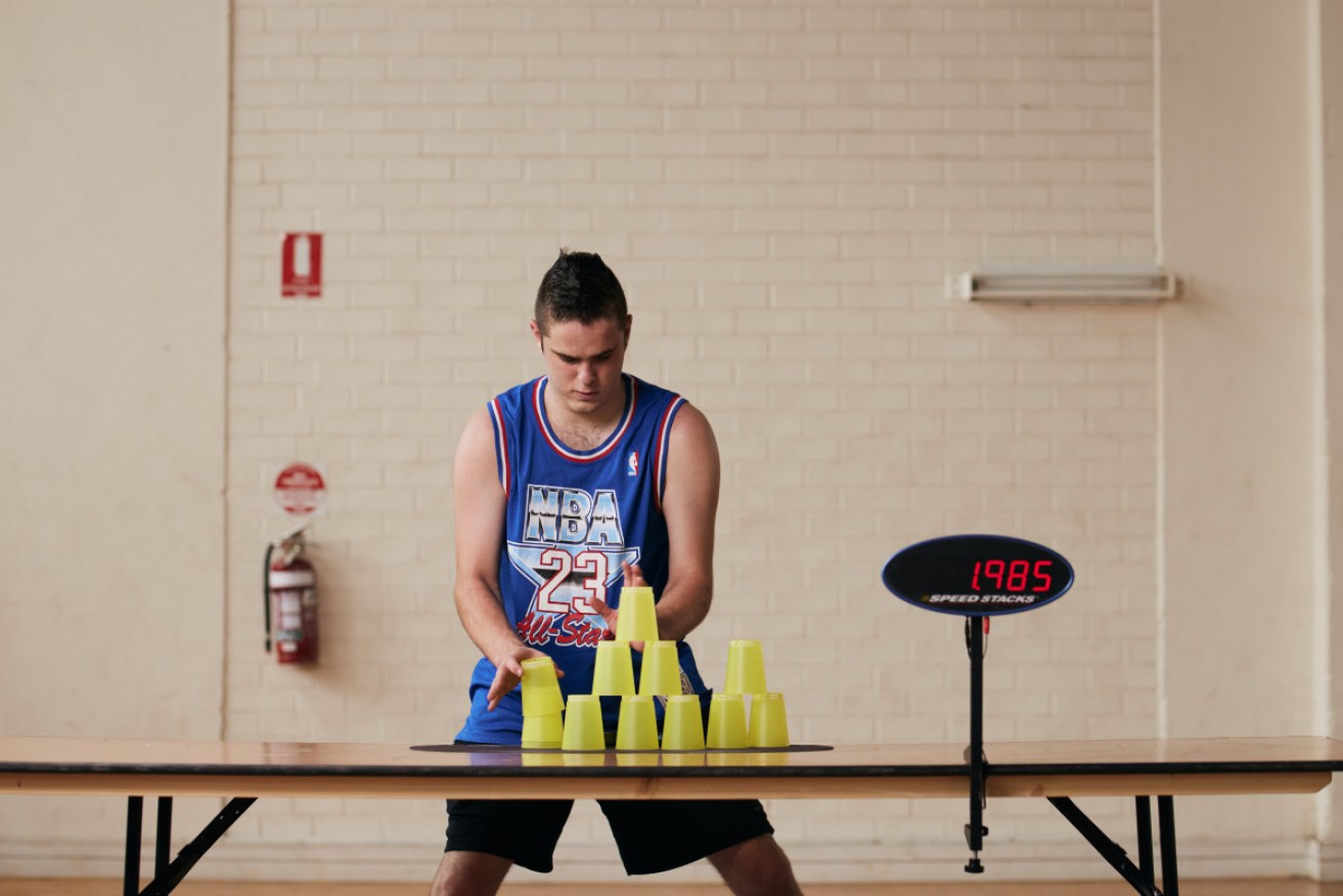 Jaydyn Coggins, 18, is training for the international cup stacking championships. He's already the national champ. <i>Photo: AAP</i>