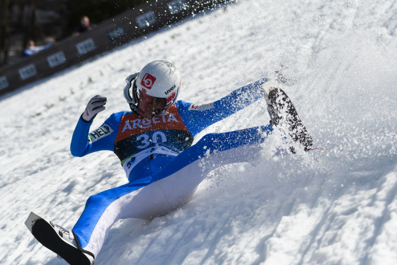 Daniel Andre Tande crashes during the FIS Ski Jumping World Cup Flying Hill Individual competition in Planica.