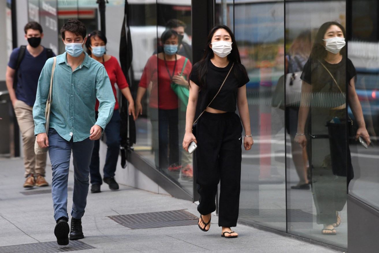 Millions of Australians have been urged to wear masks as COVID cases peak in coming days.