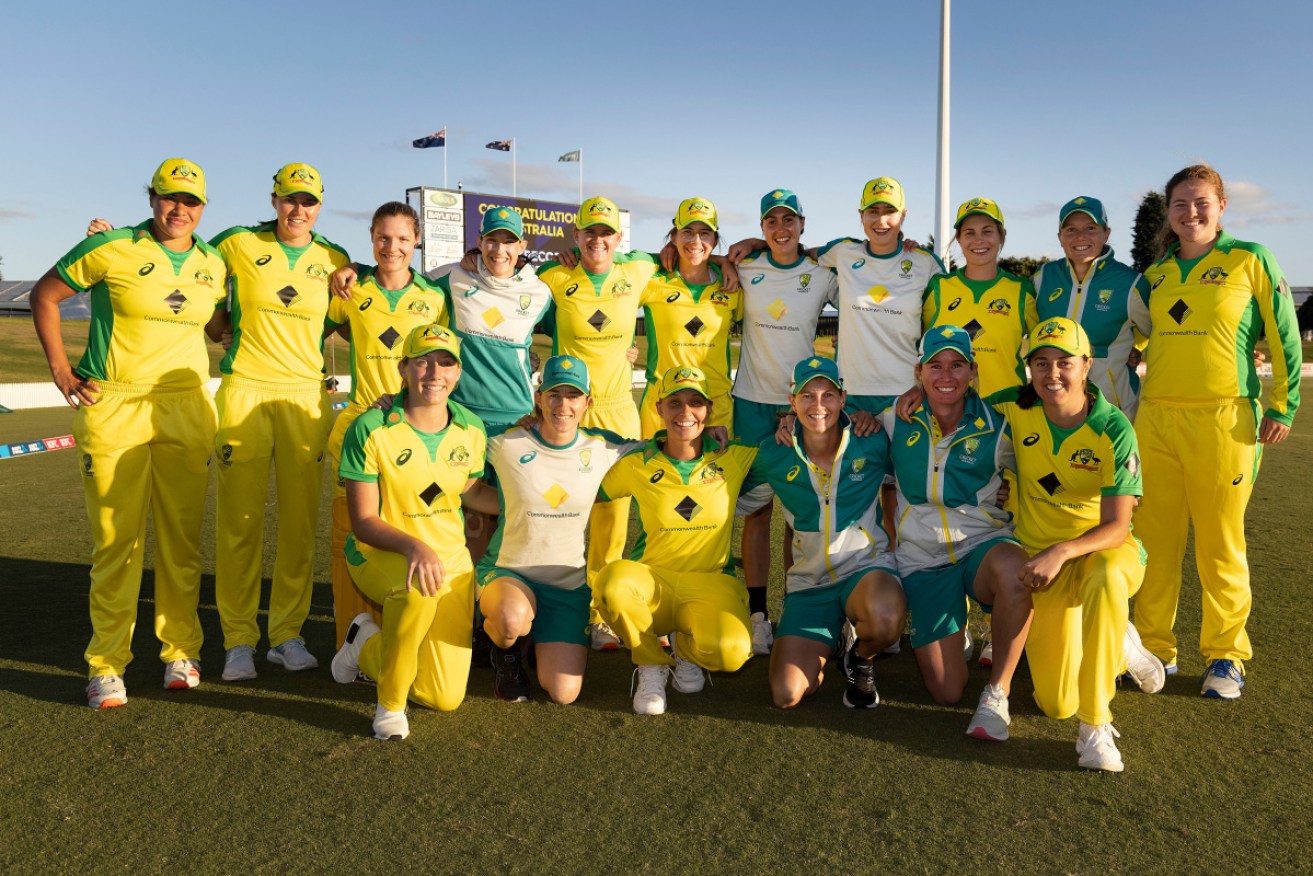 The record-breaking Australian women cricketers after Sunday's win. 