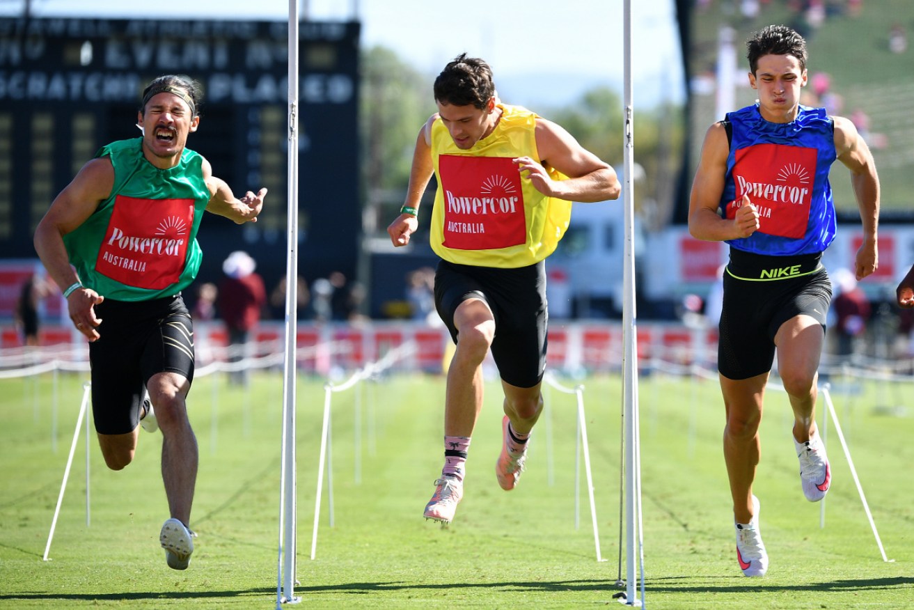 Edward Ward (left) hangs to win the 139th Powercor Stawell Gift at Central Park on Monday.