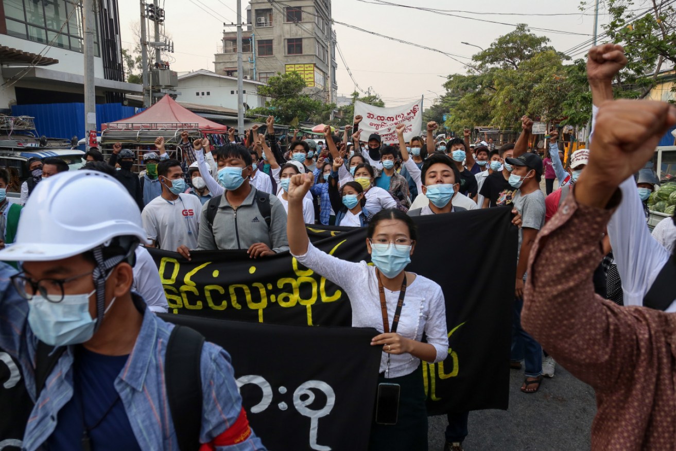 Demonstrators march during an anti-military coup protest in Mandalay, Myanmar, on Monday. 