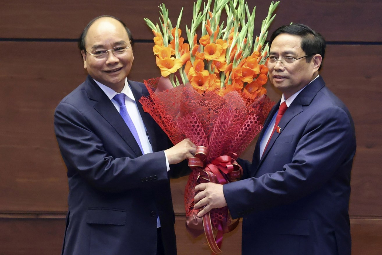 Newly elected Vietnamese President Nguyen Xuan Phuc, and Prime Minister Pham Minh Chinh  in Hanoi on Monday.