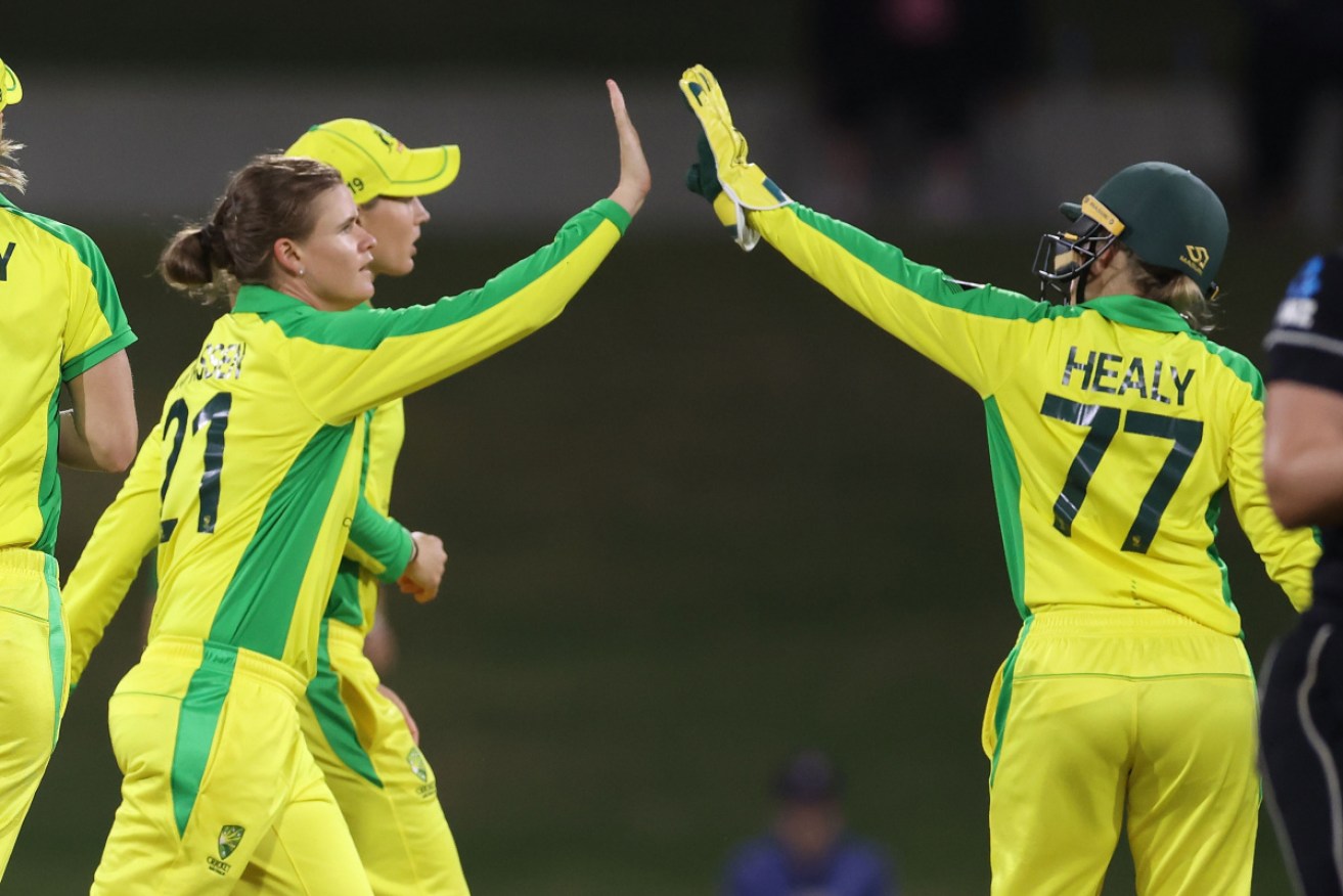 Australia's Jess Jonassen celebrates the wicket of Amelia Kerr with Alyssa Healy at Mount Maunganui on Wednesday.