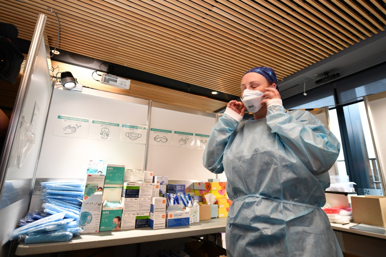 A healthcare worker at the Four Points by Sheraton, which will be one of Victoria's quarantine hotels.