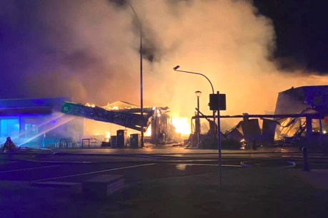 Motel evacuated as ferocious fire destroys tourist town shops