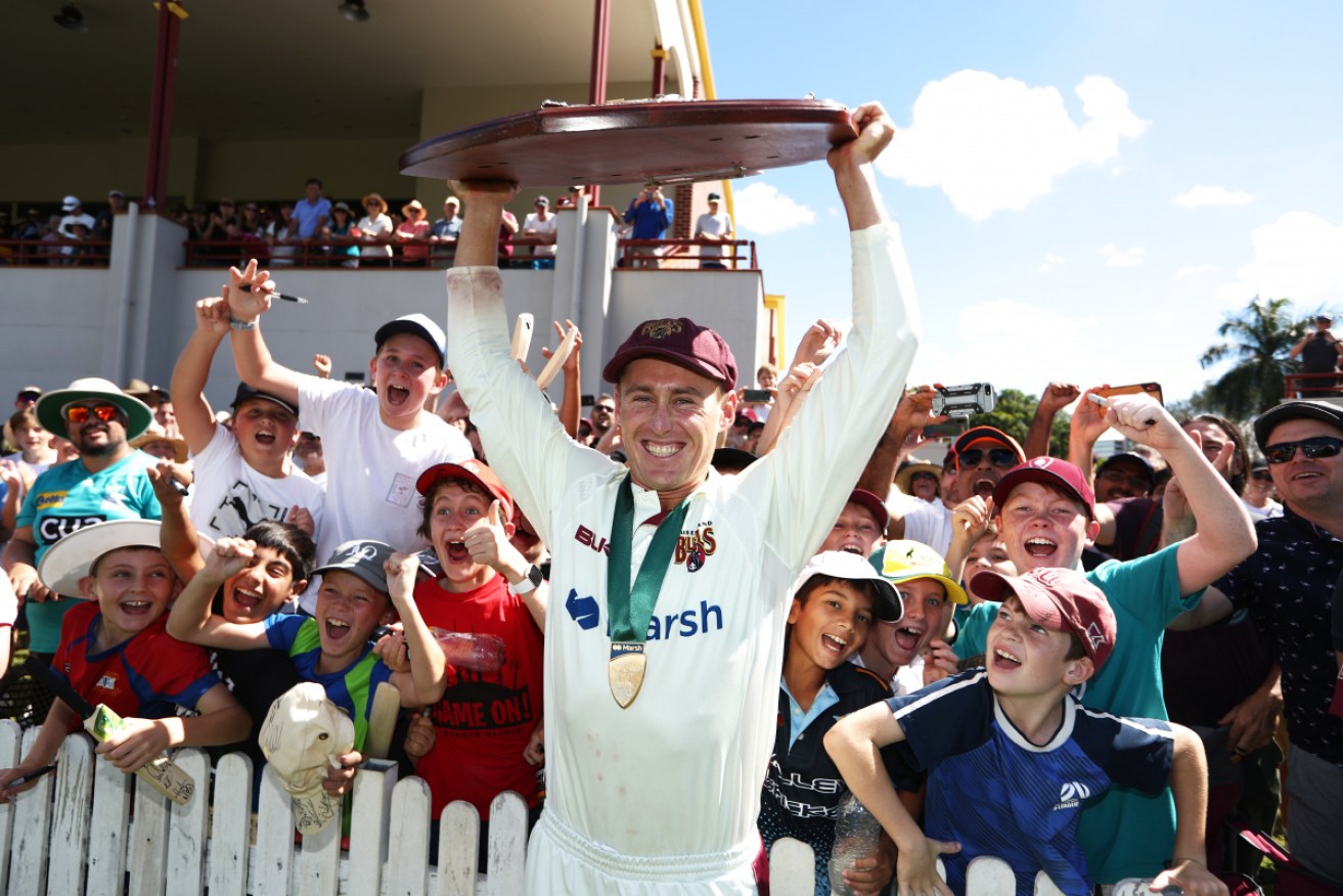 Queensland's Marnus Labuschagne celebrates winning the Sheffield Shield title in stunning fashion.