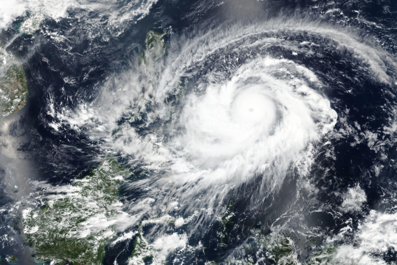 A satellite image shows Typhoon Surigae approaching the Philippines.