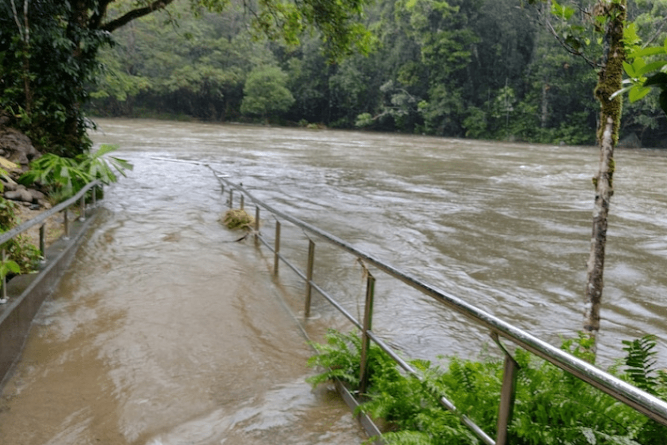 The popular swimming spot of Babinda Boulders has become a raging river.