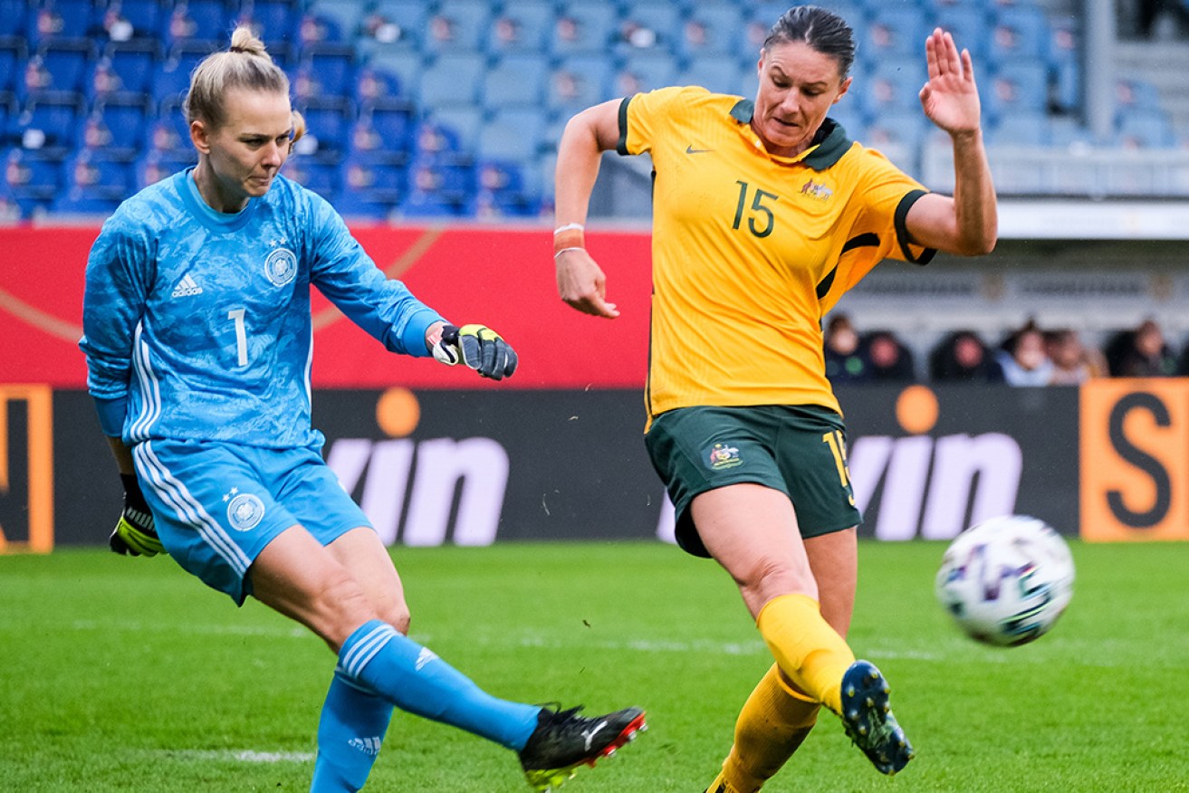 German goolkepper Merle Frohms clears from Australia's Emily Gielnik in Wiesbaden on April 10.