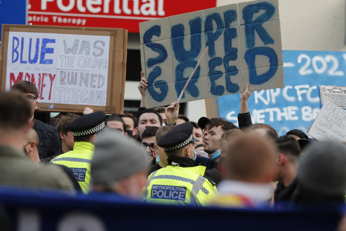 Chelsea fans protest against Chelsea's decision to be included amongst the clubs attempting to form a new European Super League. The plan collapsed late on Wednesday.