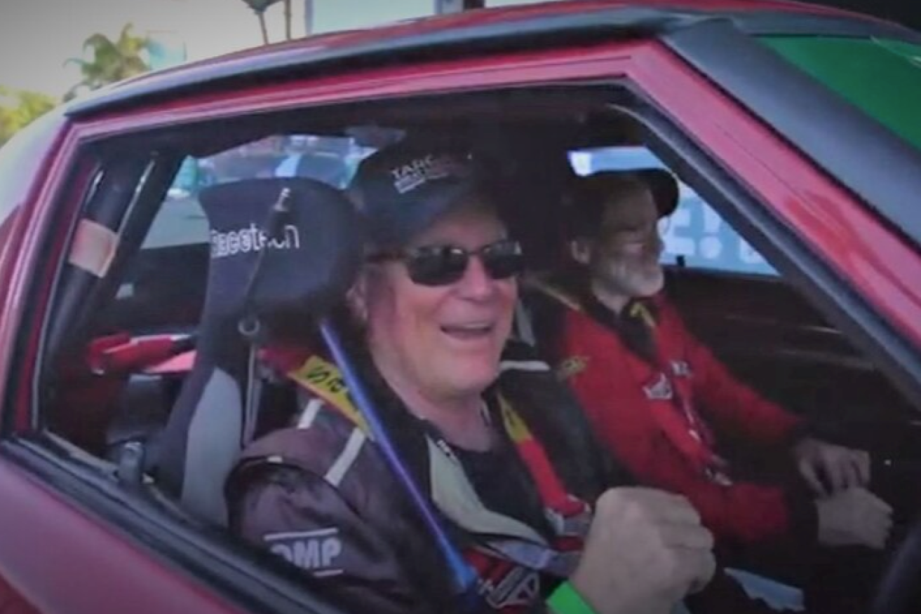 Shane Navin with Glenn Evans in their Mazda RX7 during a race in 2019.