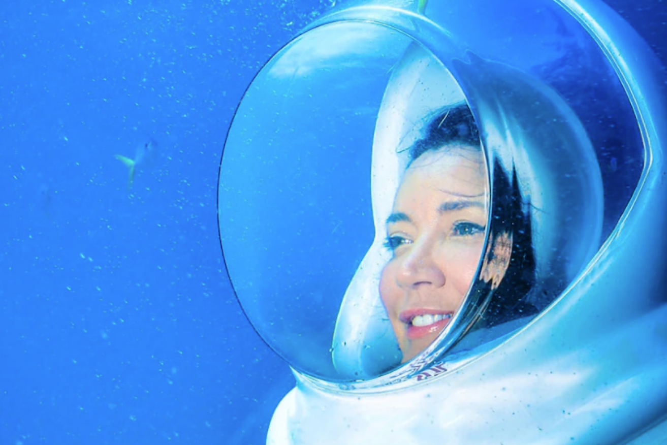 Toni Childs under water in the bubble-style helmet that she bought from Japan.