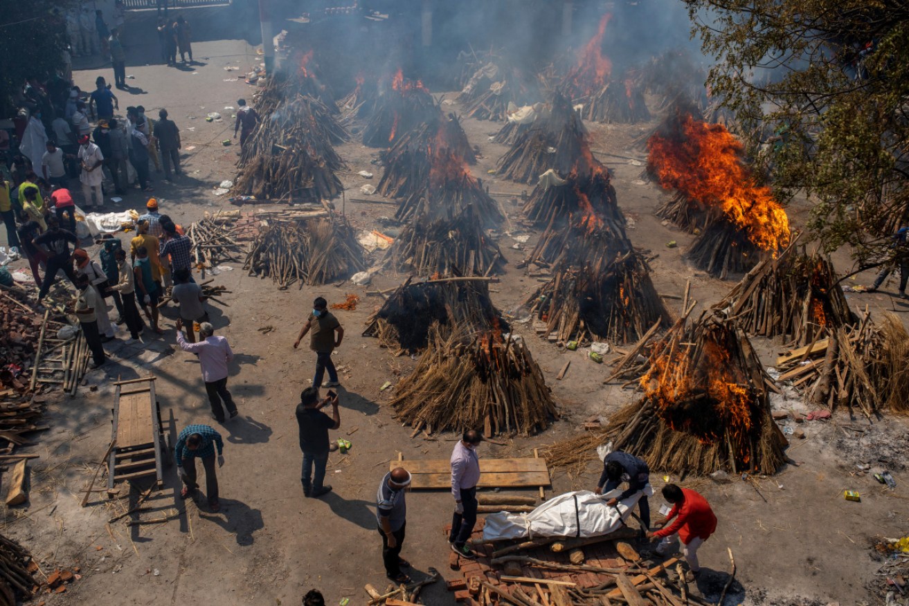 India is battling a record surge in coronavirus infections, as people try to access essential medical supplies.