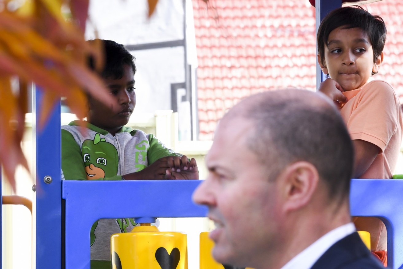 Josh Frydenberg spruiks his government's childcare pledge at a Canberra centre on Sunday.