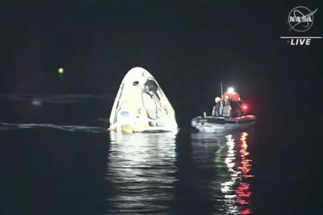 SpaceX astronauts return with ‘dark’ splashdown