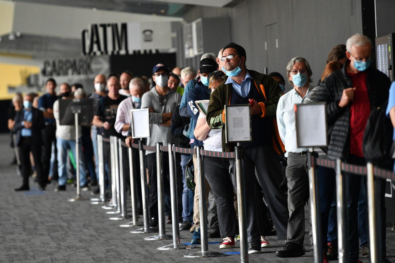 Melburnians queue for their Covid-19 vaccination at the Melbourne Convention and Exhibition Centre vaccination centre in Melbourne on Monday.