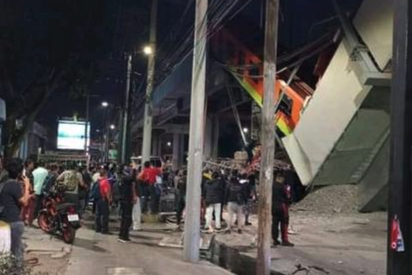 Crowds at the scene shortly after the deadly crash in Mexico City.