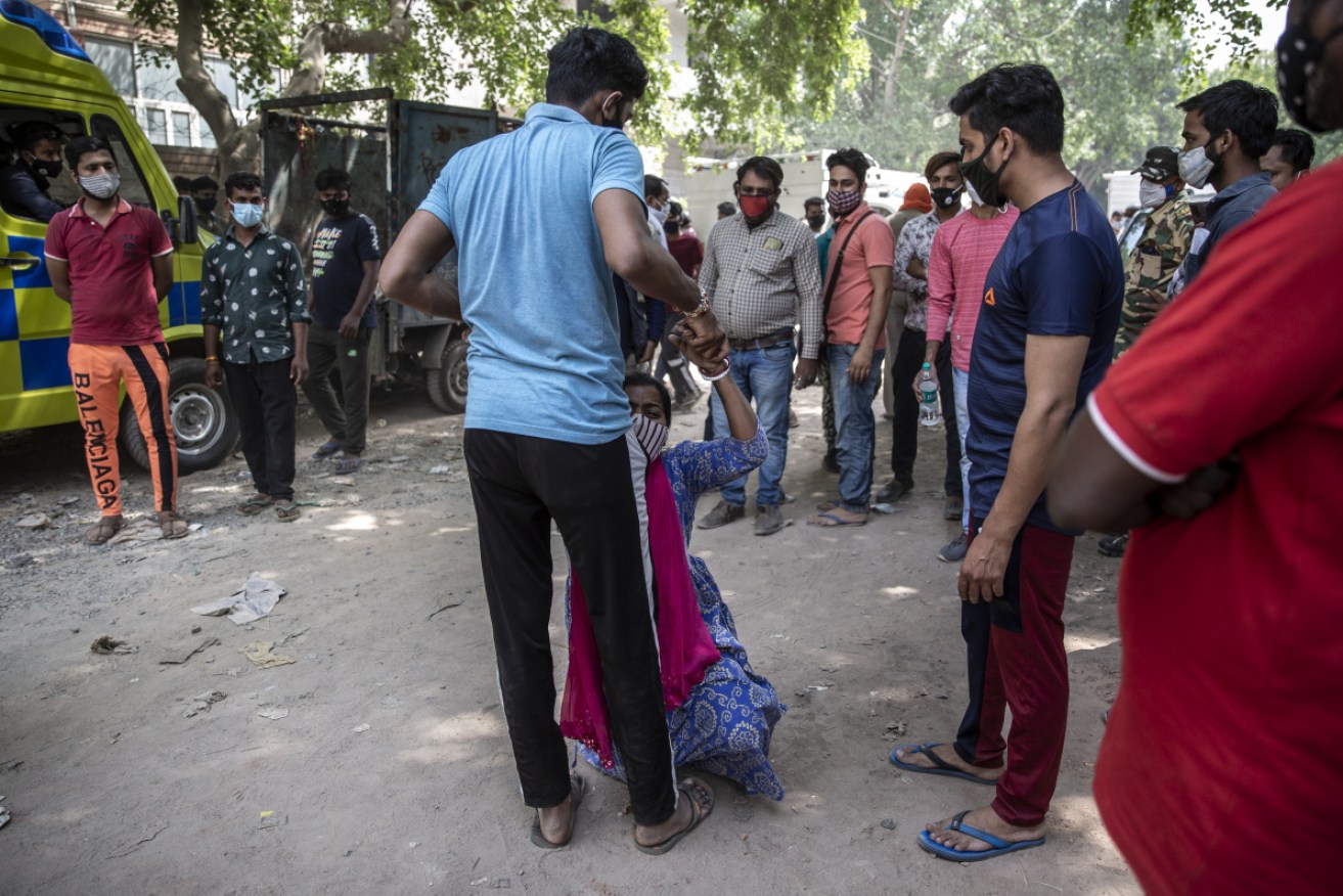 Shruti Saha breaks down in a New Delhi street as the country reaches breaking point.