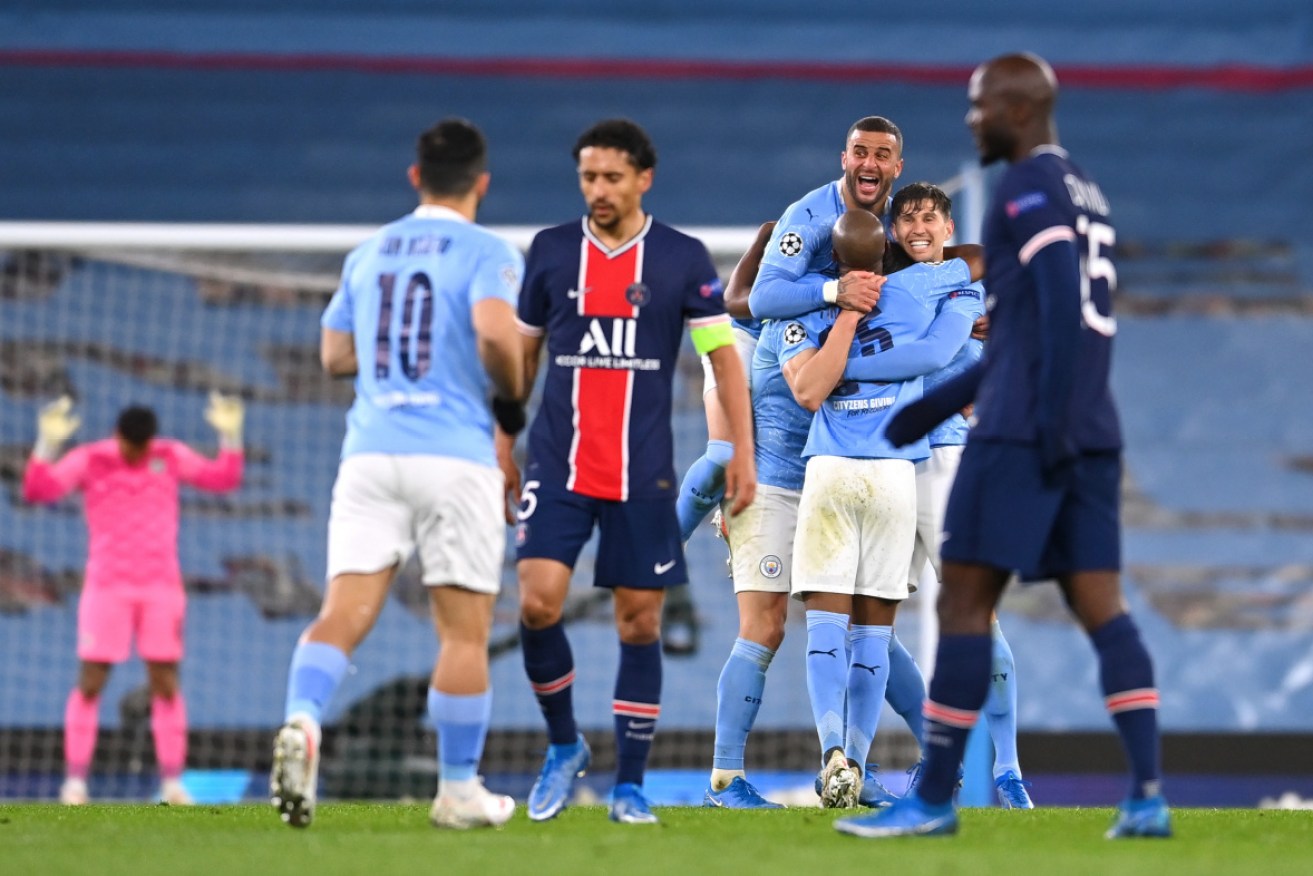 Manchester City players celebrate reaching the Champions League final after defeating PSG.