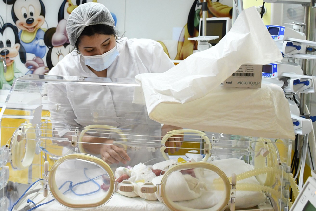 A nurse in the Casablanca hospital tends to one of the nine newborns.