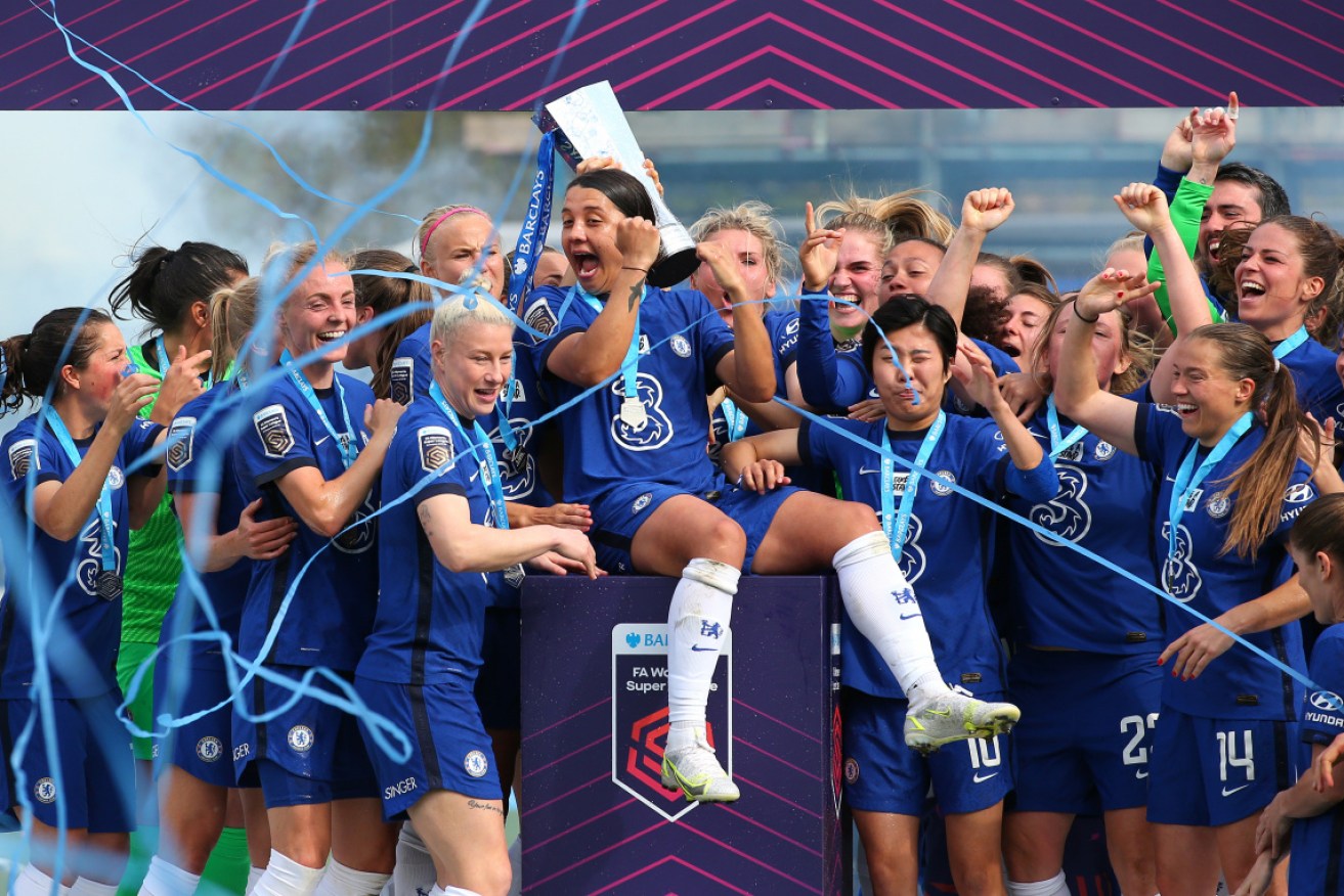Sam Kerr's mates hoist her shoulder high after Chelsea's 2021 FA Women's Super League victory.
