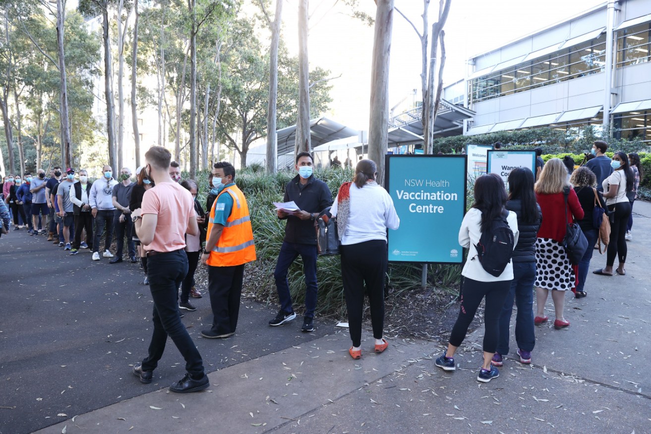 Sydneysiders wait for their vaccination at the new hub. 