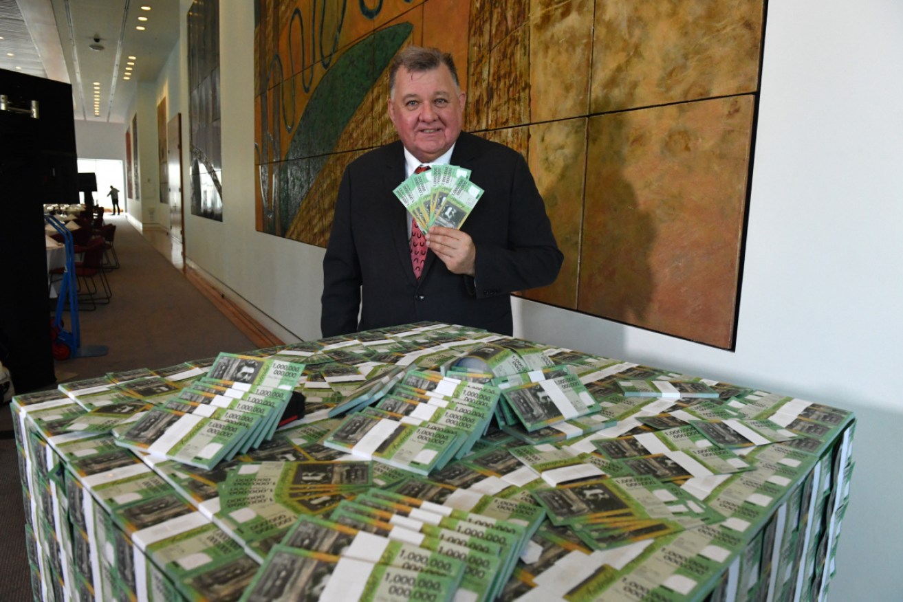 Craig Kelly and his bank notes.
