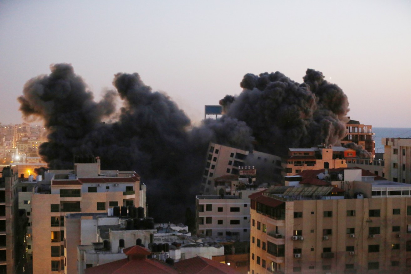 Israeli fighter jets hit a Palestinian building called "Hanady" at Al-Rimal neighbourhood in the Gaza Strip.