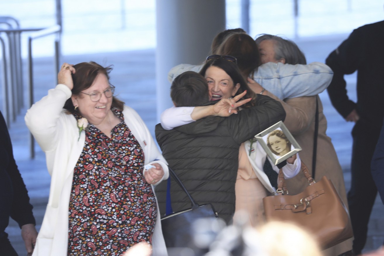 Joan Connolly, center right, whose mother was shot dead in 1971, reacts with family members after the inquest into the British Army operation in Belfast, Northern Ireland,