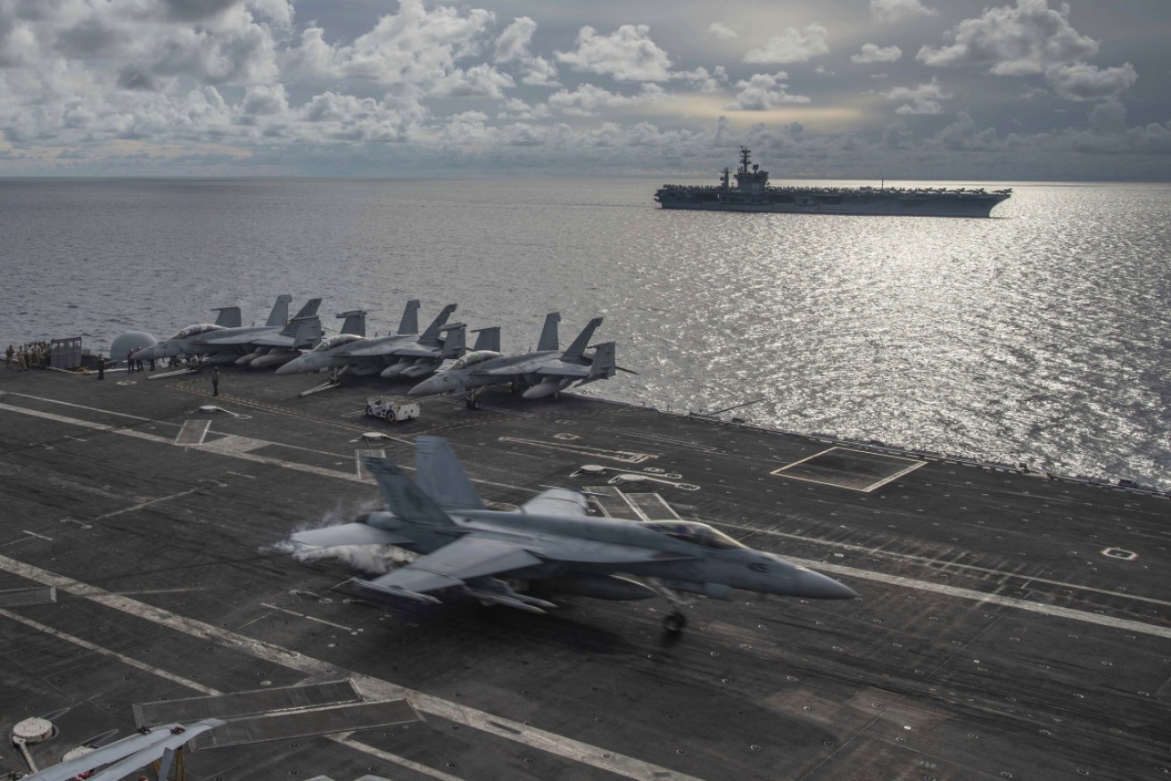China's fleet has ringed Taiwan while its warplanes violate the island's airspace. <i>Photo: AAP</i>