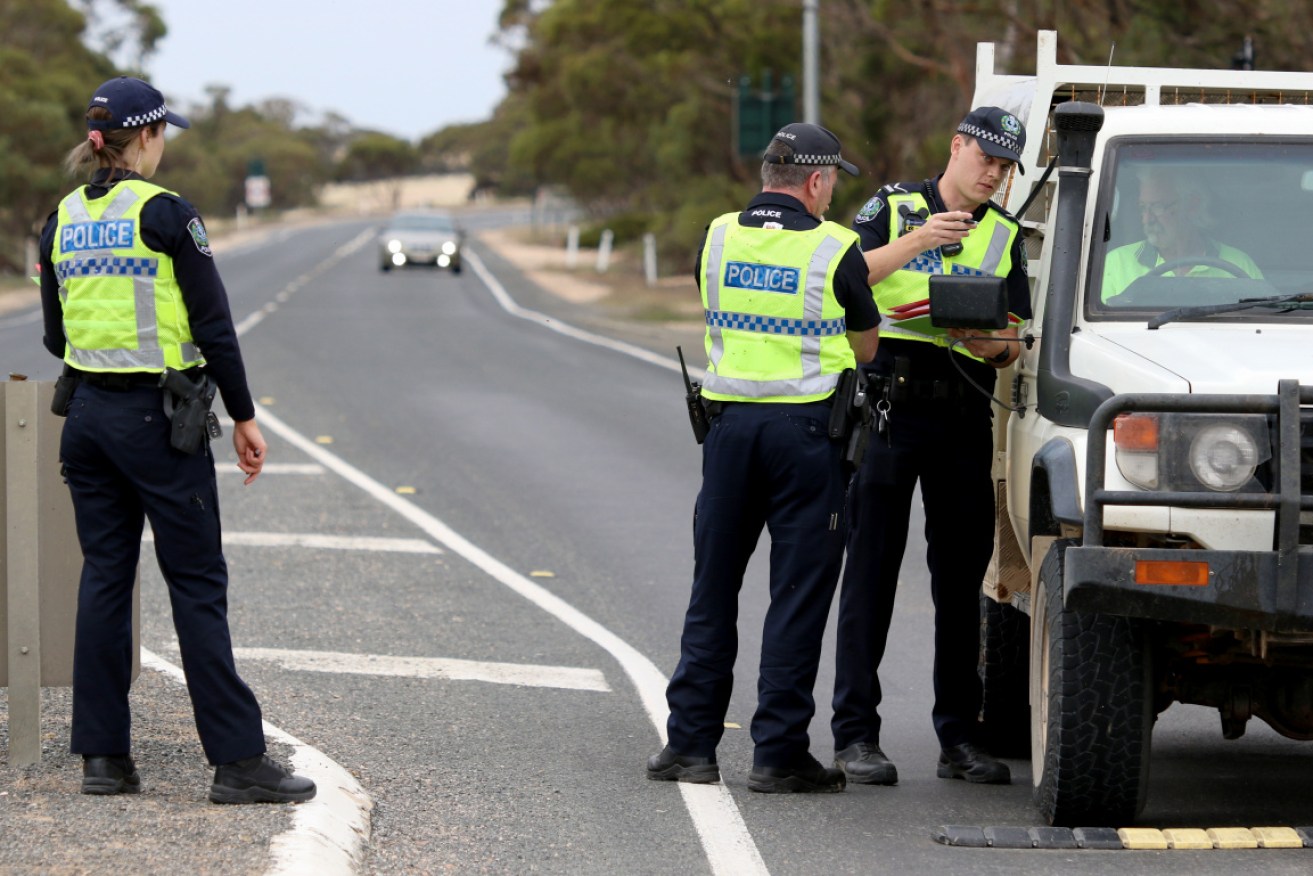 South Australia has its border closed to NSW and Victoria, with many locals still trying to get home.