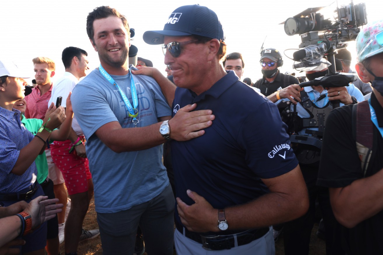 Phil Mickelson (right) with Spain's Jon Rahm after Monday's victory.