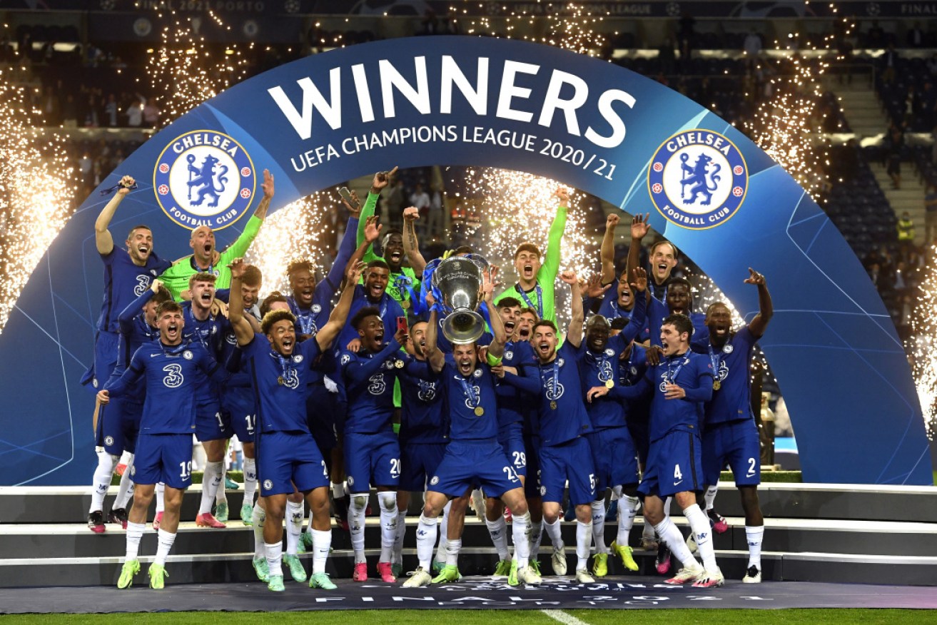 Chelsea celebrates with the trophy after winning the UEFA Champions League final in Porto on Sunday.